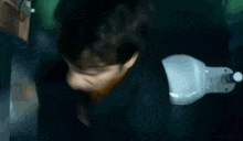 a blurry picture of a person laying on their back with their eyes closed