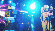 a person in a robot costume playing a keyboard with gifrun.com at the bottom