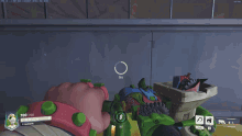 a screenshot of a video game shows a person holding a green object that says 700/100