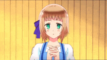 a little girl with brown hair and green eyes is praying