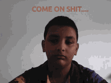 a young boy with the words come on shit written above him