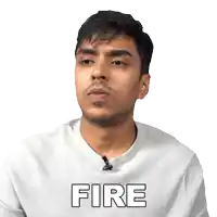 a man wearing a white shirt with the word fire written on it