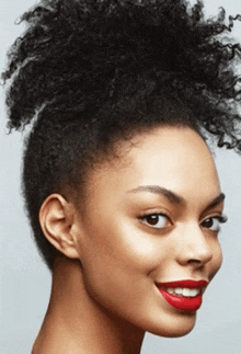 a close up of a woman 's face with red lipstick .