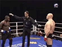 a referee in a boxing ring with a can sign on the side