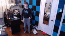 a boy wearing headphones and a shirt with the word fox on it
