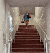 a woman is walking up a set of stairs