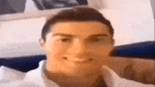 a close up of a man 's face with a smile on it .