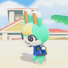 a cartoon bunny wearing a blue shirt with k on it