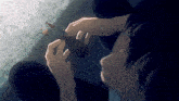 a person is holding a tool in their hands and looking at it