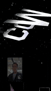 a man is standing in front of a poster that says cowboy
