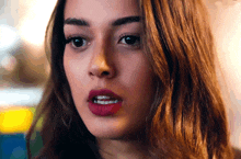 a close up of a woman with red lipstick on her lips