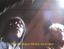 a man in a hooded jacket with the words gothbodilique till my soul take on the bottom
