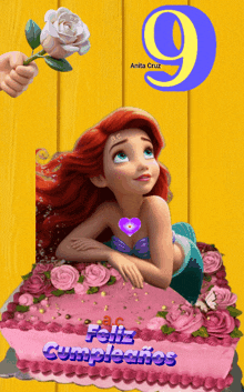 a picture of a little mermaid on a cake with the number 9 on it