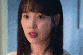 a close up of a woman 's face with her mouth open