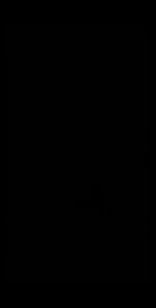 a person is smiling in the dark with sunglasses on .
