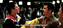 a group of men are talking to each other and one of them says hey does this coke smell funny