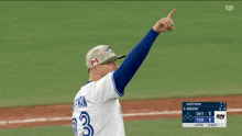 a baseball player wearing a blue jersey with the number 33 on it