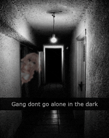 a dark hallway with the words gang dont go alone in the dark on the bottom