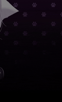 a black background with purple paw prints and a cat 's head .