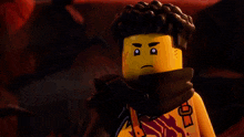 a lego character is holding a glowing sword over his head