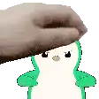 a person is petting a green and white penguin with a brown hat on its head .
