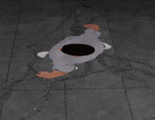 a person laying on the floor with a hole in the middle of their head