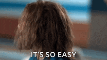 a close up of a person 's head with the words `` it 's so easy '' written on it .