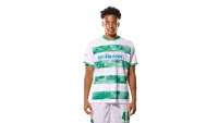 a young man wearing a green and white hofmann shirt