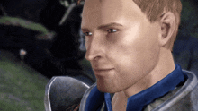 a close up of a man wearing a blue shirt