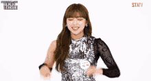 a girl in a sequined top with a name tag that says ' statv ' on it