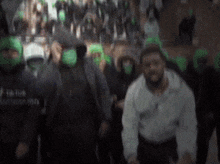 a blurry picture of a group of people wearing masks