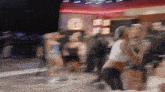 a blurry picture of a woman dancing with the word zous on the bottom