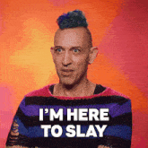 a man in a striped sweater says i 'm here to slay