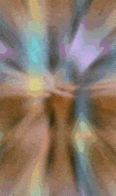 a blurry picture of a person 's face with a purple and blue background
