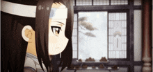 a cartoon character with long hair and a bandage on his head is standing in front of a window .