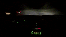 the inside of a car with a clock that says the time is 9:40