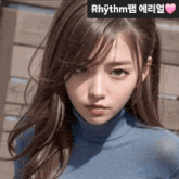 a woman in a blue turtleneck sweater with rhythm written on the bottom right