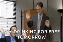 two men are dancing in an office with the words `` day drinking for free tomorrow '' written below them .