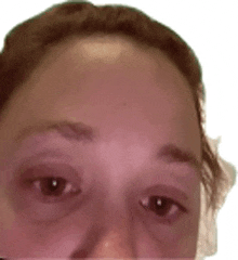 a close up of a woman 's face with a blurred background