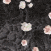 a woman 's face is surrounded by flowers and a purple letter g