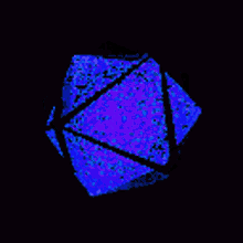 a close up of a blue and purple object on a black background