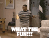 a man in a striped sweater is dancing in a living room with the words " what the fun " above him