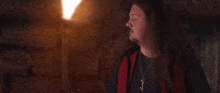 a man with long hair says that 's unpleasant in a dark room