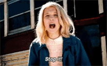a girl with blonde hair is screaming and says stop it .