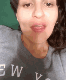 a close up of a woman wearing a shirt that says ew