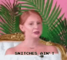 a woman is sitting in a bathtub with the words snitches ain 't written on the bottom .