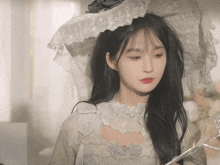 a girl wearing a white dress and a hat