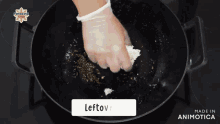 a person is cooking in a pan with a label that says leftove on it
