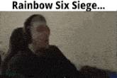 a man wearing headphones says rainbow six siege