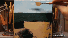 a painting is being painted on a canvas and the words made in animotica are visible